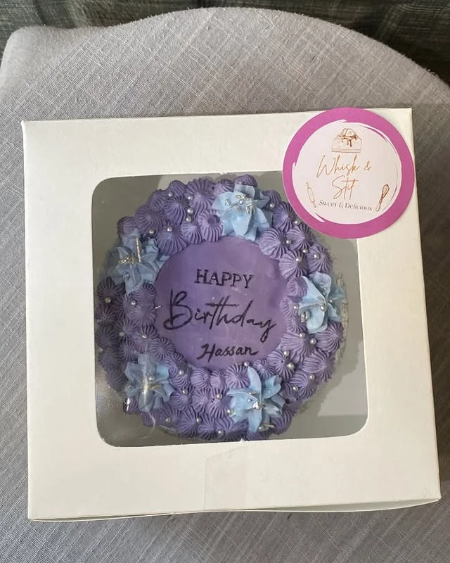 Birthday cake for Hassan with blueberry design and 'Happy Birthday Hassan' message - Blueberry Cakes Karachi By Whisk And Sift